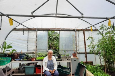 Annika Miller Jones in the polytunnel at Calthorpe Community Garden. Copyright: Mayya Husseini