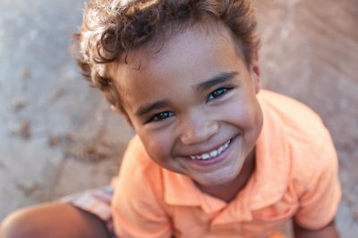 Boy smiling. Credit: Andrew Coop | Unsplash