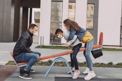 Family in masks on see-saw. Credit: Photo by Gustavo Fring from Pexels