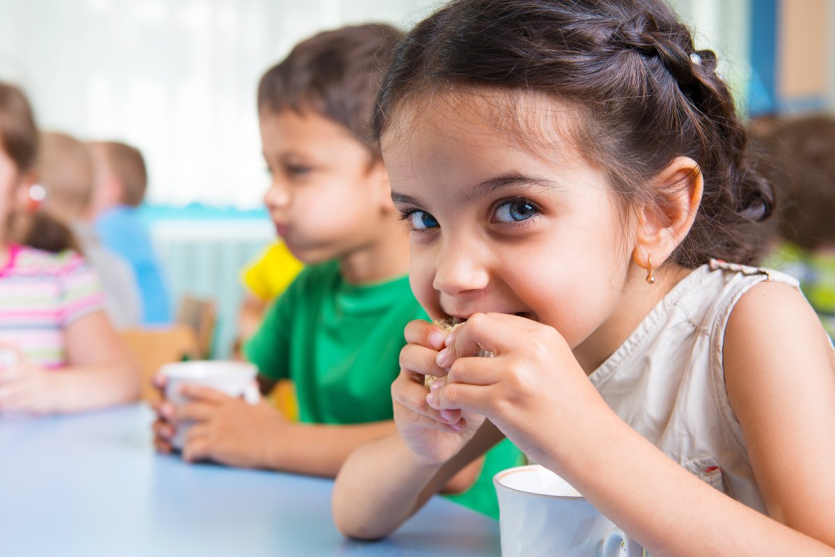 Young children enjoying a snack at school. Copyright: petrograd99 | iStock
