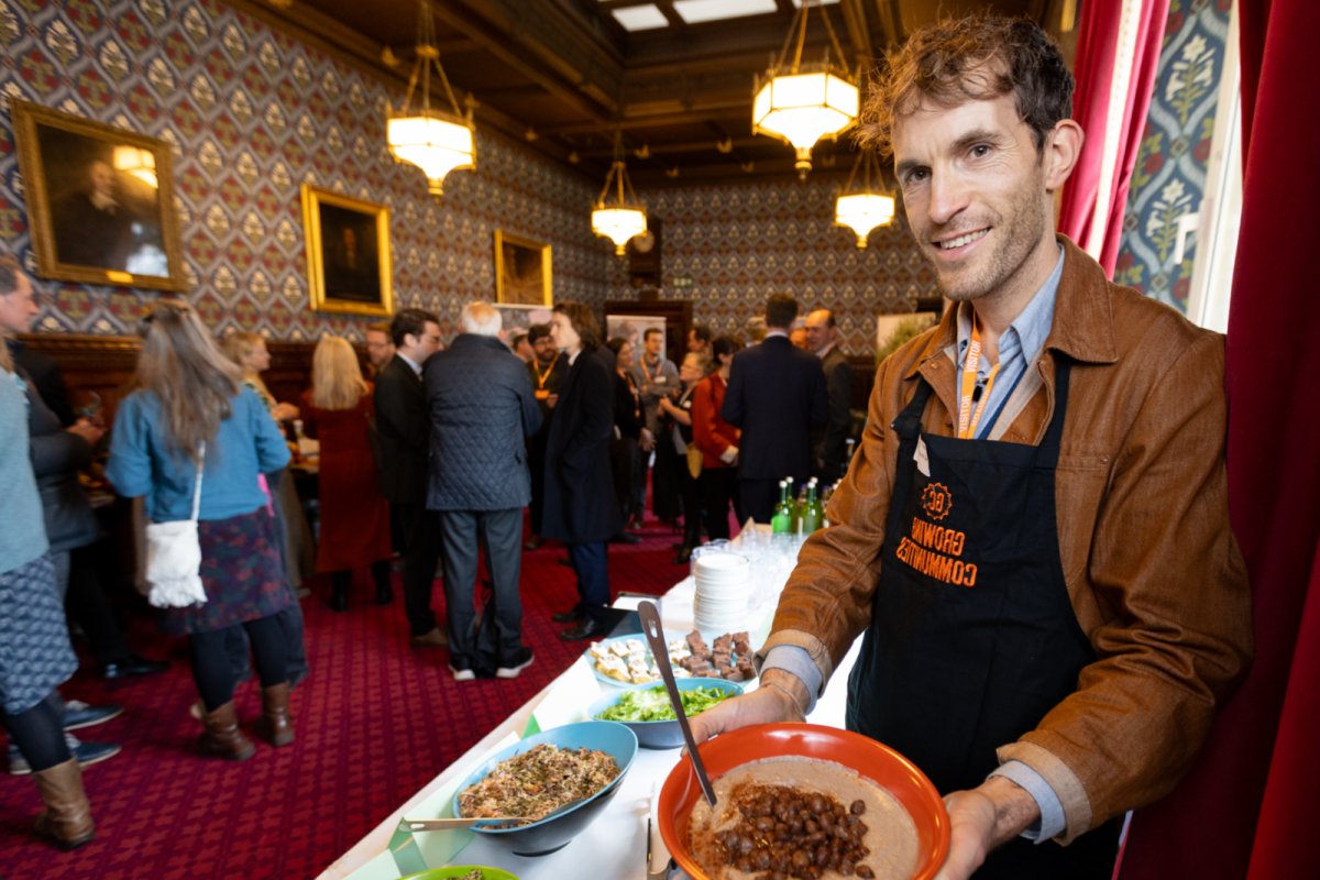 Growing Communities Chef, James, showcases agroecological produce in a delicious lunch for MPs. Copyright: Jonathan Goldberg