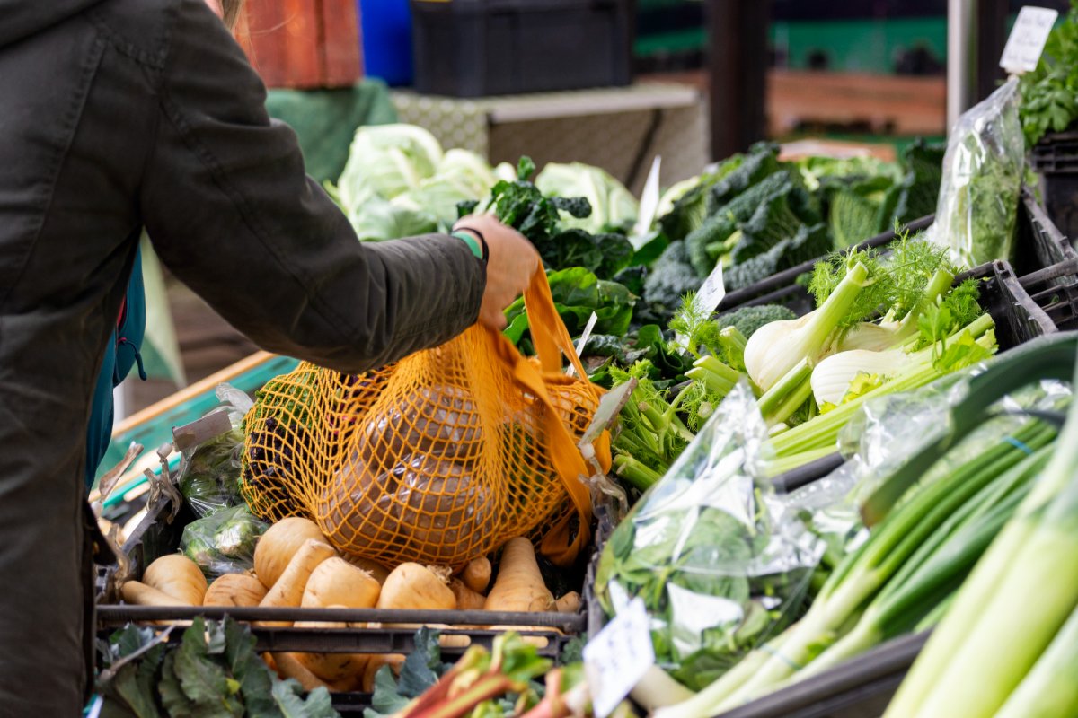 Grocery shopping for farm fresh produce at local outdoor market stall. Copyright: Ahrys Art | istock
