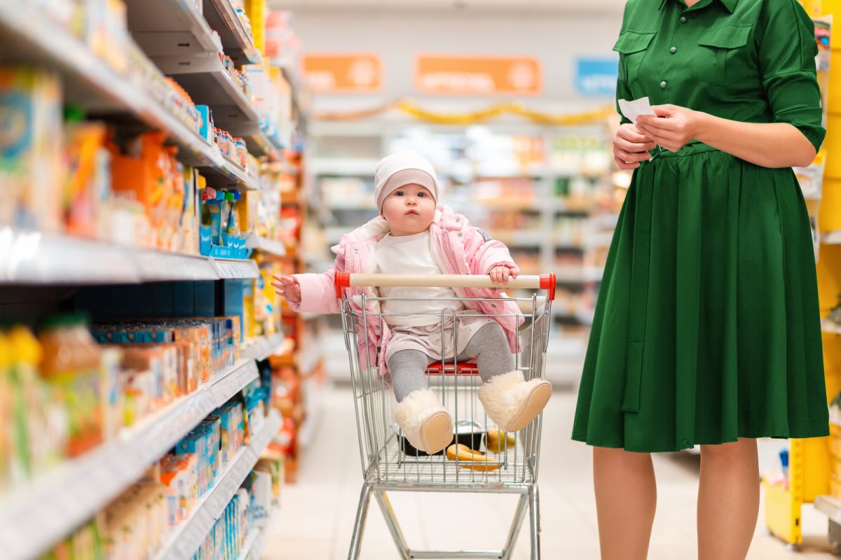 A mother and baby at the supermarket. Credit: STEKLO | shutterstock