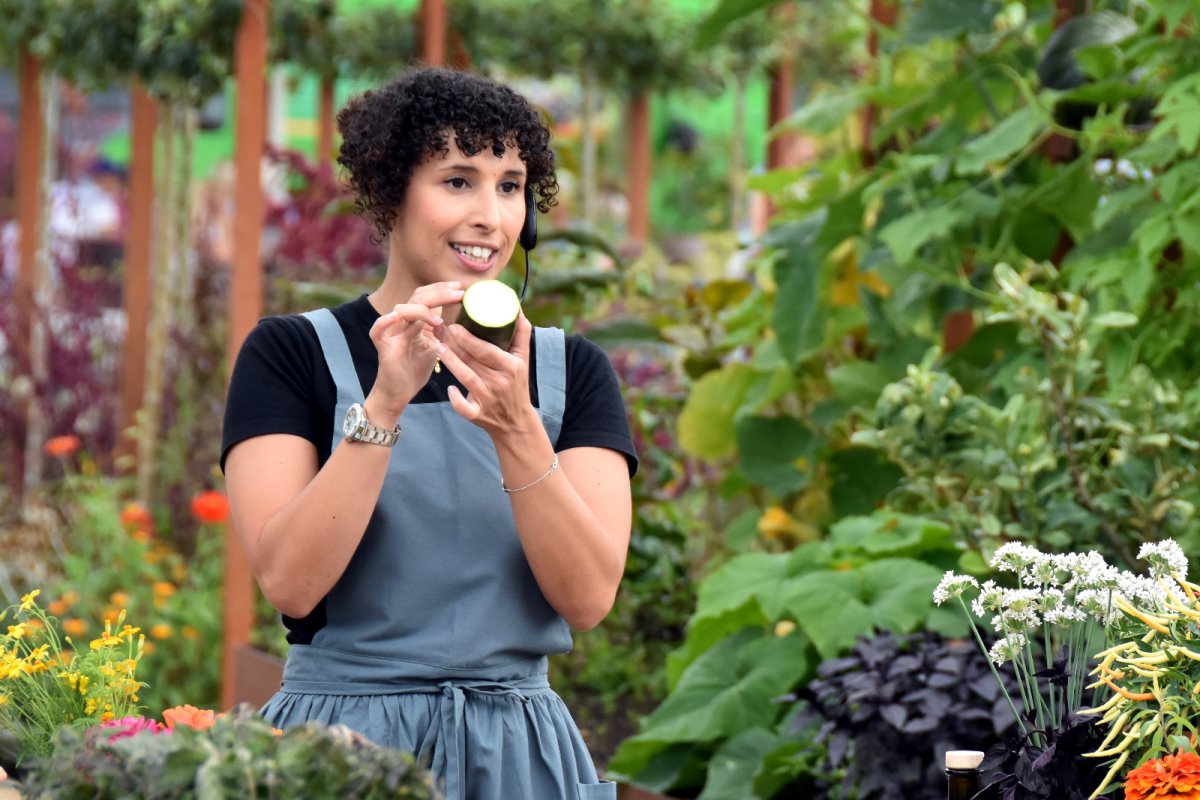 Sam Ratanji running a food education session amongst plants. Credit: The Life Larder