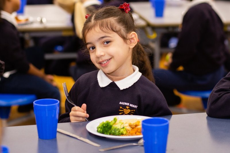 Enjoying a healthy lunch at Sacred Heart School, Battersea. Credit: Jon Goldberg / Children's Food Campaign. Credit: 