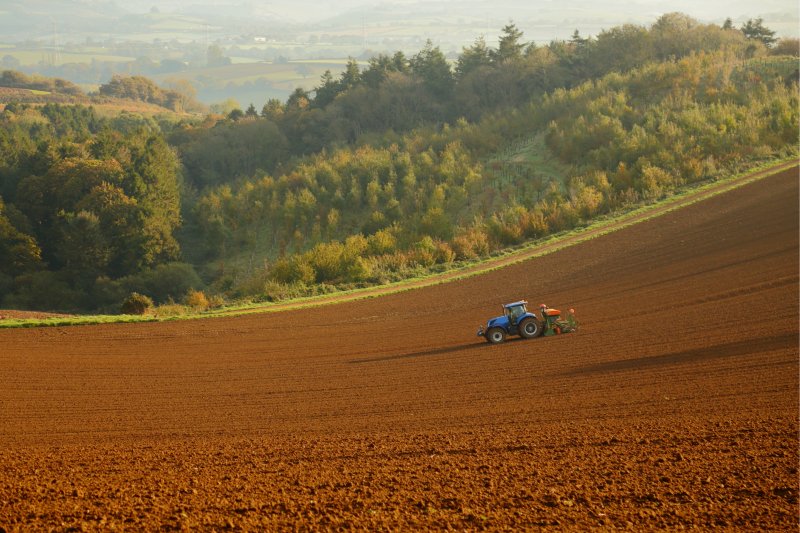 Tractor ploughing agricultural field in Dorset. Copyright: savoilic | Istock