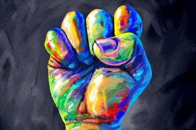  A clenched fist painted in diverse colours.. Copyright: Lightspring | shutterstock