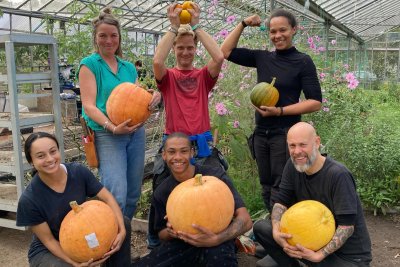 Growers at Organiclea proudly displaying their pumpkin harvest. Credit: Organiclea
