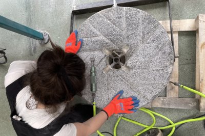Emma Shires dressing a millstone. Copyright: Amy Warman
