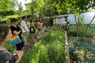 GET OUT founder and director, Kieran Harkin, giving visitors of tour of the charity's food forest gardens.. Copyright: GET OUT Charity