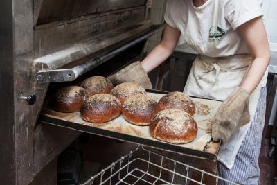 Unloading the oven. Copyright: Infinity Bakery