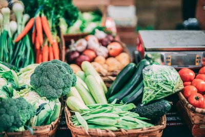 Several baskets of colourful vegetables on a table. Credit: Iñigo De la Maza | Unsplash