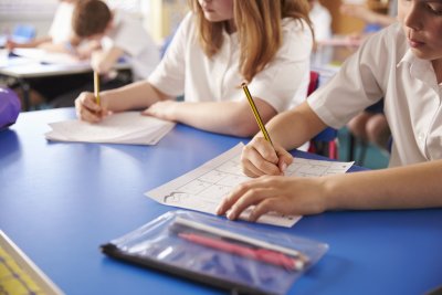 Primary school children working in class. Copyright: Monkey Business Images | Shutterstock