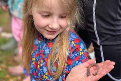 Making friends with worms at the community garden. Credit: Rooted Community Food 