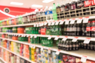Blurred image of soft drinks aisle in supermarket. . Copyright: Trong Nguyen | shutterstock