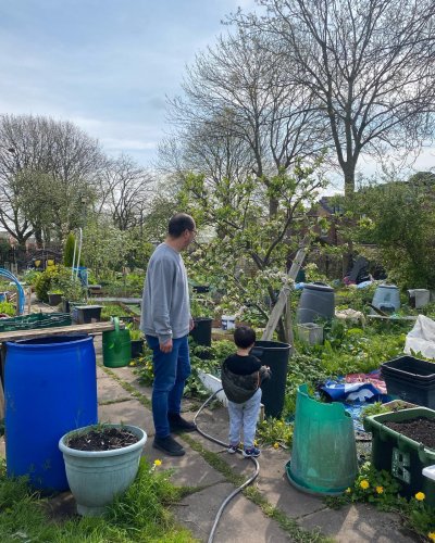 A family in a community garden. Credit: Sow the City