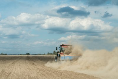 A tractor ploughing a dry field.. Credit: Shestakov Dmytro