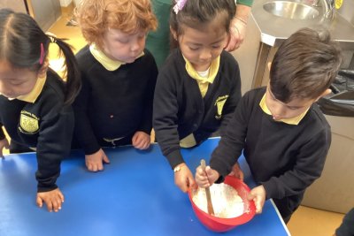 Charlton children making bread. Copyright: Joe Grollman