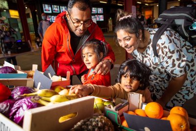 A family at the Carbon Supermarket. Credit: Sow the City