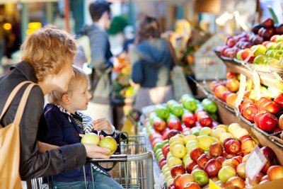 Mother and her son buying fruit. Copyright: Aleksei Potov | Shutterstock