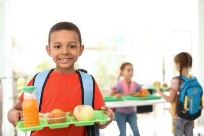 Young boy with school lunch. Copyright: New Africa | shutterstock