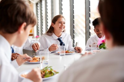 A group of students having school lunch. Copyright: Monkey Business Images shutterstock