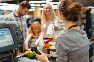 A family shopping together at the supermarket checkout. Copyright: Dean Drobot shutterstock