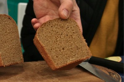 Andrew Whitley holding wholemeal Real Bread. Credit: Chris Young / www.realbreadcampaign.org CC-BY-SA-4.0