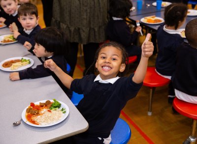 Young boy says yes to school food for all. Credit: Sustain