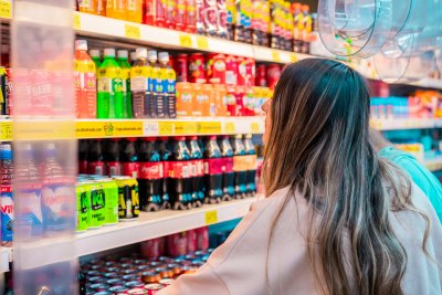 Girl looking at soft drinks in a shop. Copyright: © 2023. Provided by Impact on Urban Health licensed via a?CC BY-NC-ND 4.0 license Girl looking at soft drinks in a shop. Copyright: © 2023. Provided by Impact on Urban Health licensed via a?CC BY-NC-ND 4.0 license
