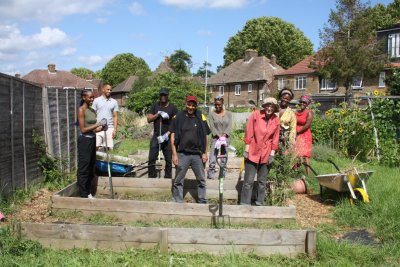 The community at the garden working together in the garden. Copyright: Coco Collective