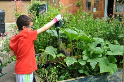 A local child taking part in Gardening Club activities. Copyright: Josiah Braithwaite Community Garden