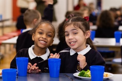 Children enjoy a healthy school lunch. Credit: Jon Goldberg / Children's Food Campaign