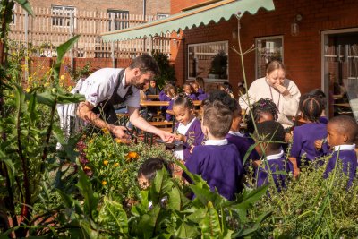 Chef Tom and students in the kitchen garden. Copyright: Jim Stephenson