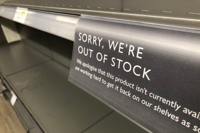 Out of Stock sign in a supermarket shelf.. Copyright: Kauka Jarvi shutterstock