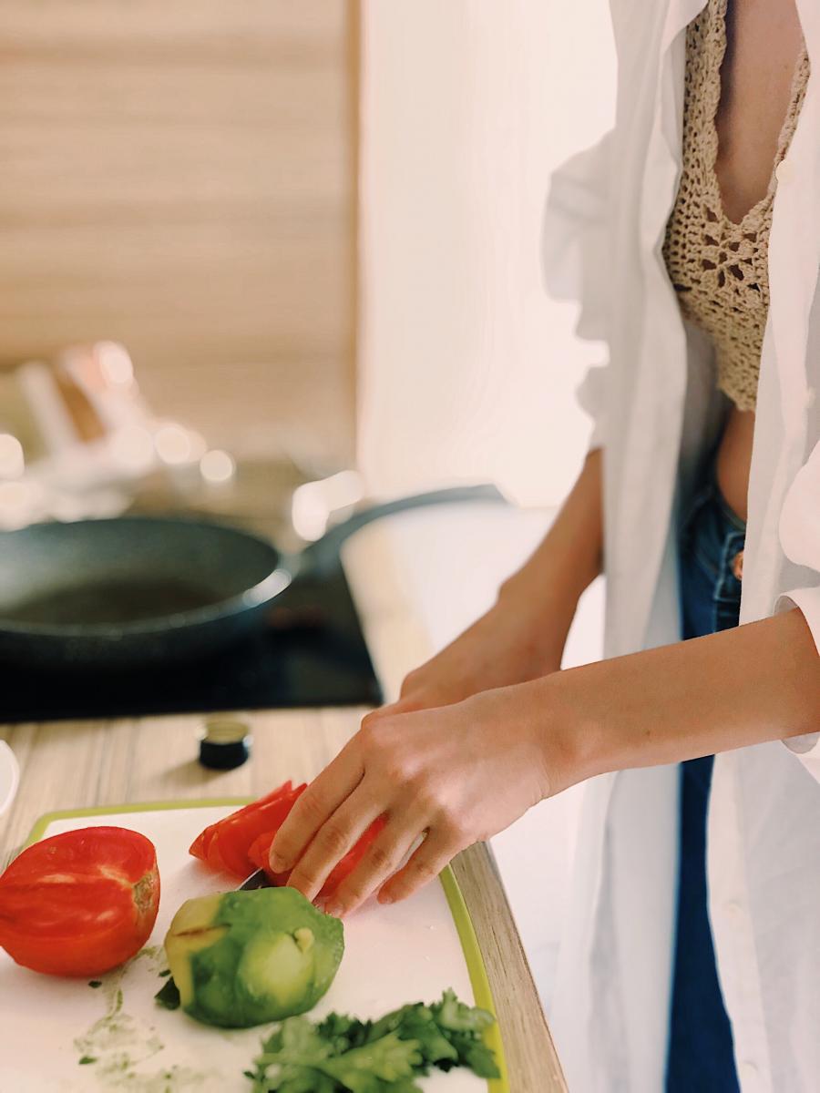 Woman cooking. Photo credit: Pexels