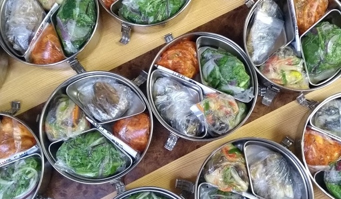 Freshly prepared meals on wheels ready for delivery at the Eunpyeong Senior Welfare Center by Simon Shaw