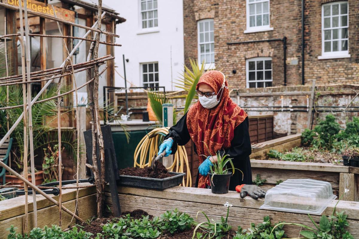 A volunteer at Calthorpe Community Garden. Credit: Emily Munster