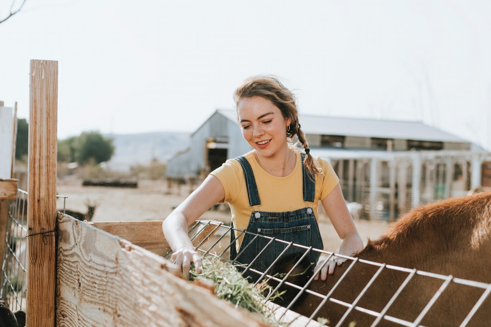 Young woman on a farm. Photo credit: Pexels