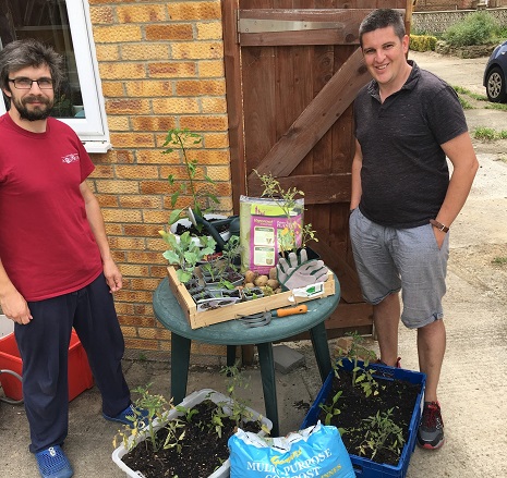 John Puplett (left), founding member, and David, home harvester. Harvest @ Home provide a variety of mini gardens as well as pre-planted seedlings in “trash to treasure” pots. 