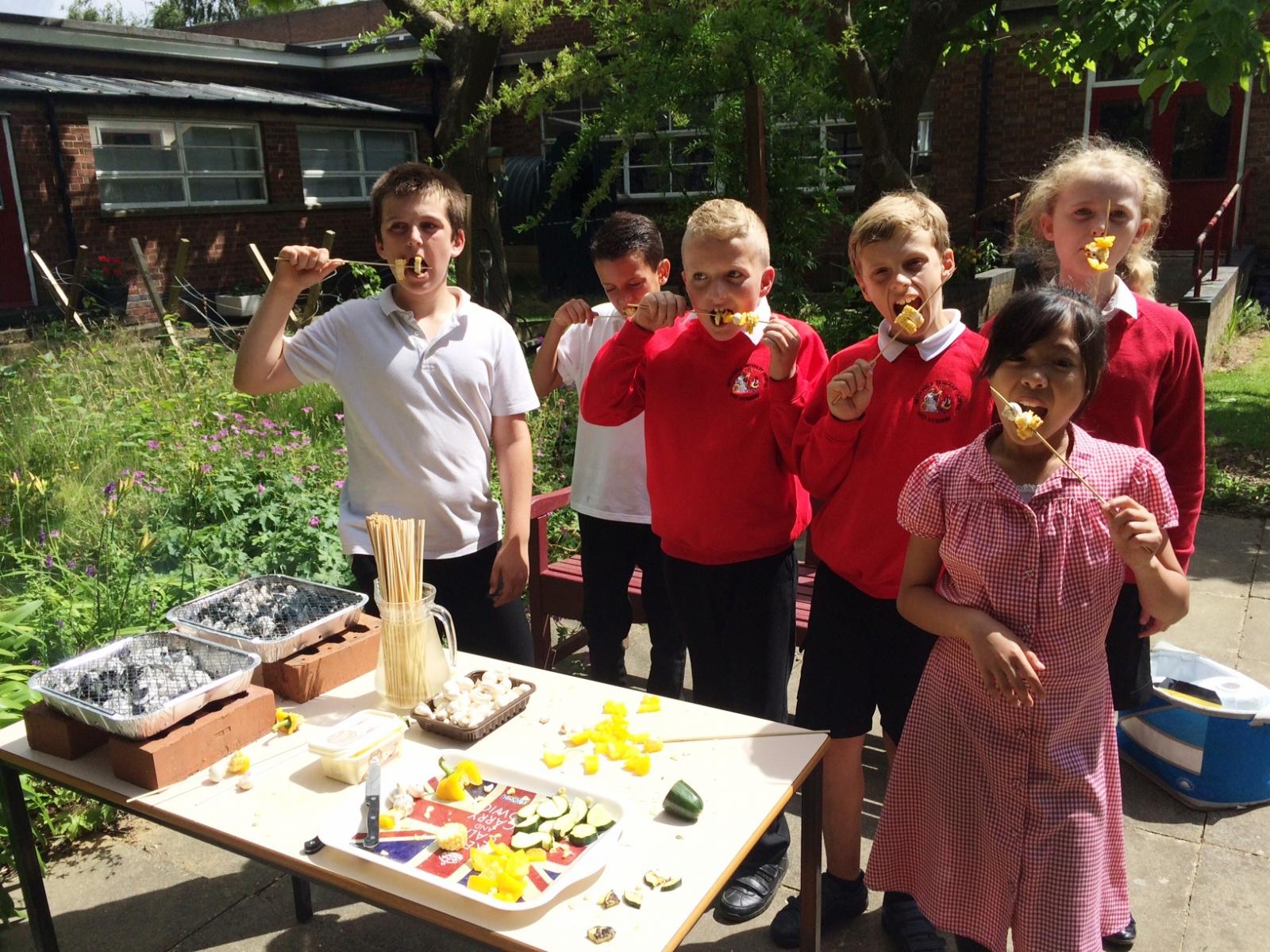 Pupils tuck into fruit and veg kebabs. Credit: Groundwork East