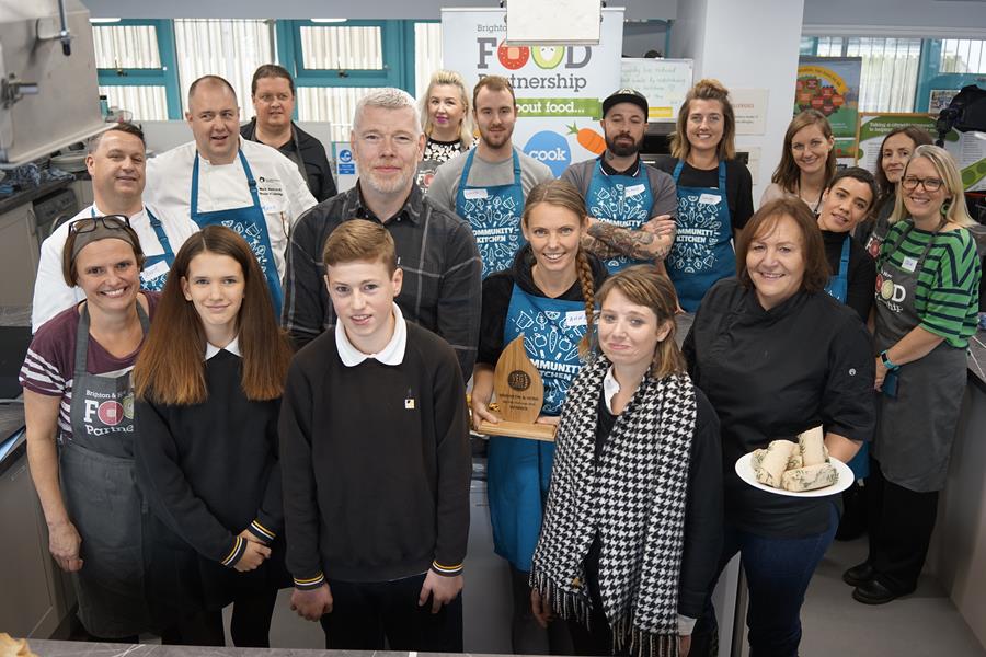 Winner Anna MacDonald from Happy Maki with the judges Michael Bremner, Nicole Pisani, Julie Barker and pupils Millie and Spike (from Dorothy Stringer Secondary School), chefs and competition organisers at the Community Kitchen. Credit: XDB photography