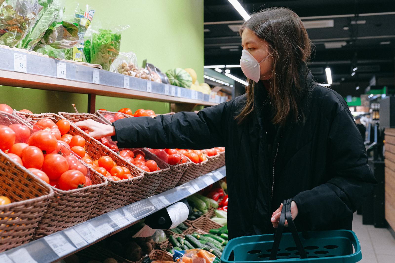 Woman shopping wearing a face mask during Covid-19. Credit: Anna Shvetz